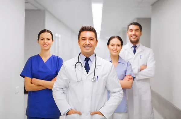 Happy group of medics or doctors at hospital