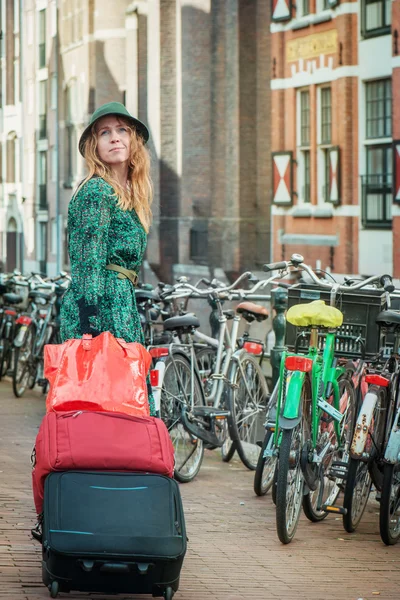 Tourist with suitcases in Amsterdam