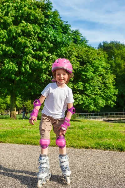 Smiling girl roller skating