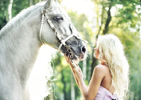 Fabulous woman with bright horse