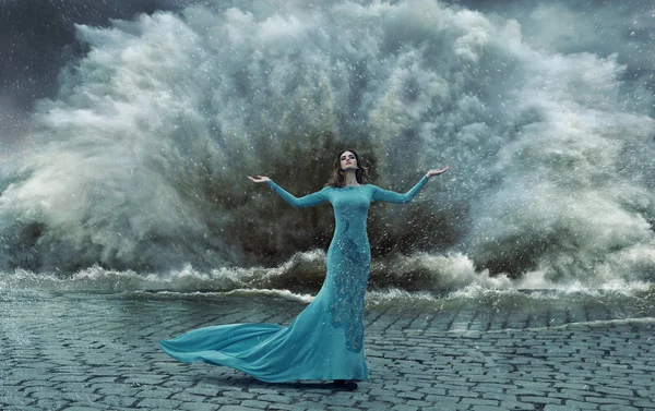 Alluring, elegant woman over the sand&water storm