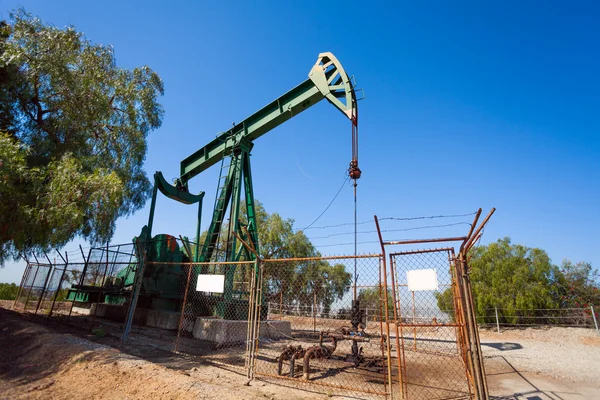 Pump jacks extract oil from an oilfield in USA