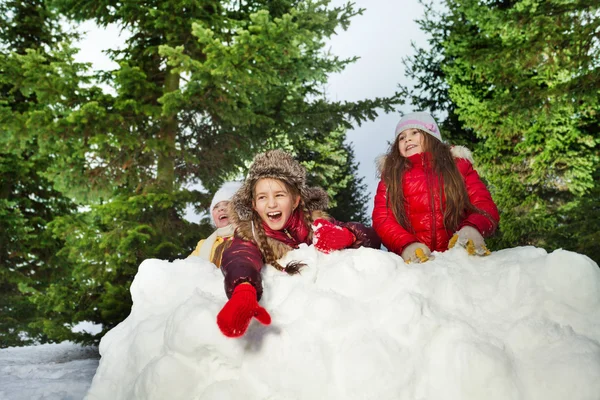 Cute girl throwing snowballs