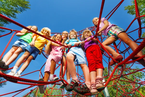 Children stand on ropes