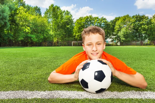 Smiling boy holding ball