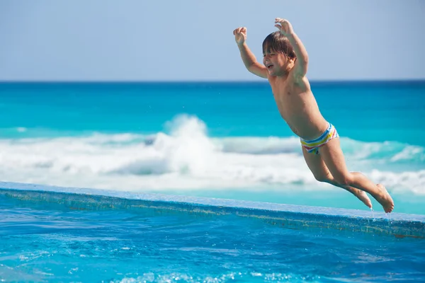 Boy Jumping to pool