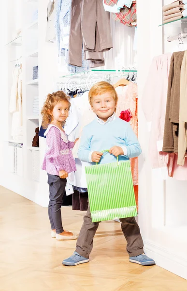 Girl and boy in clothes store