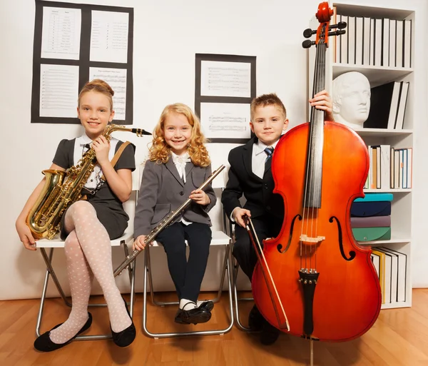 Group of kids playing musical instruments