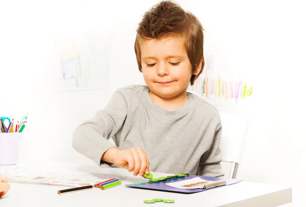 Boy putting coins as motivation to exercise