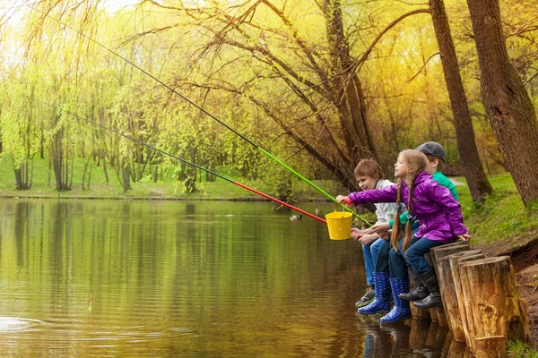 Happy kids fishing together