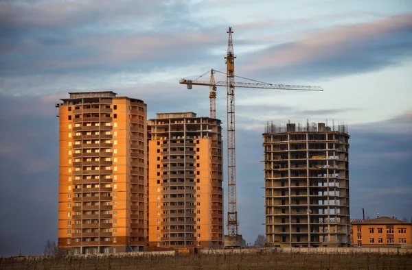 Building site against sunset sky