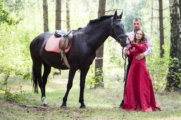 Happy couple and horse