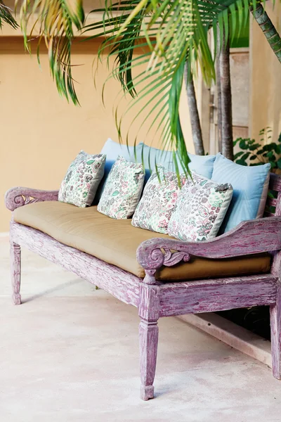 Outdoor patio seating with nice bench chairs at sunset