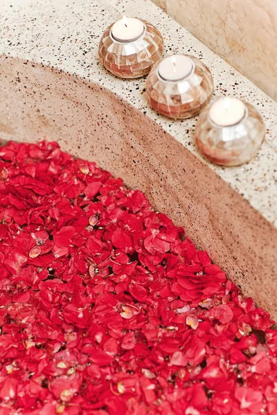 Tropical Red Flowers in Luxury Hotel Bath. Spa Decoration. Relax Mood.
