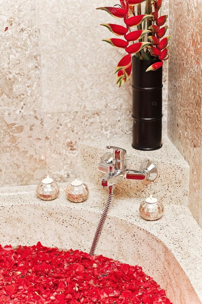 tropical red flowers in luxury hotel bath. spa decoration. relax tropical red flowers in luxury hotel bath. spa decoration. relax