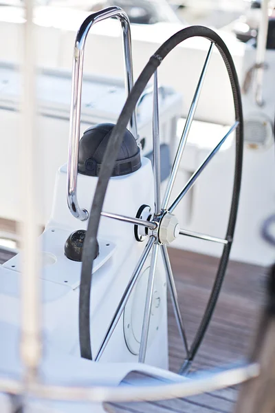 A modern sailing yacht steering wheels