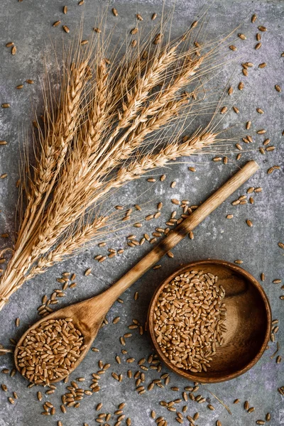 Ears of Wheat and Spoon of Wheat Grains