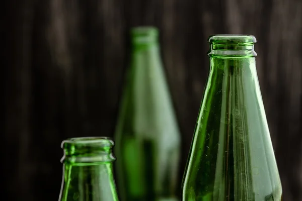 Group of Dirty Green Opened Bottles