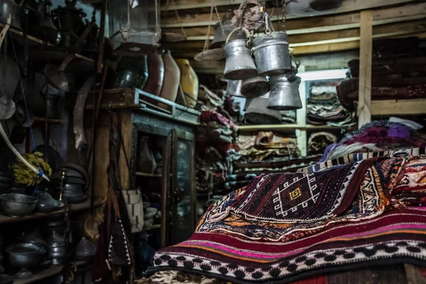 Antique Carpet and Copper Pots for Sale in an Antique Shop