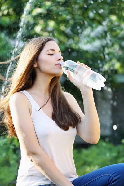 Woman drinks water