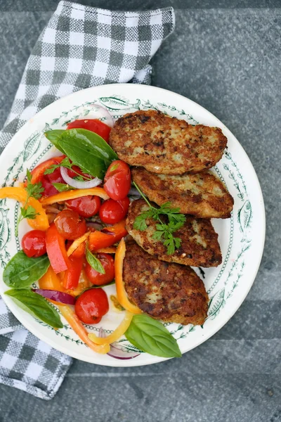 Cutlet with tomato, top view