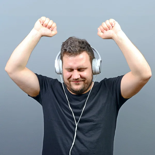 Chubby man enjoying music