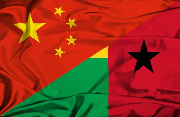 Waving flag of Guinea Bissau and China - 图库