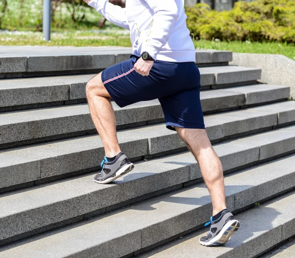 Practice - Close up of young man running up the stairs