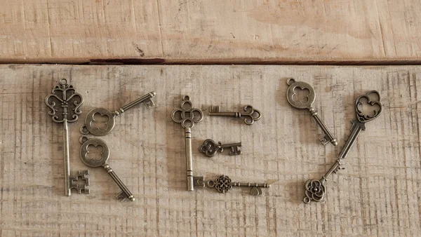 Antique keys on vintage background