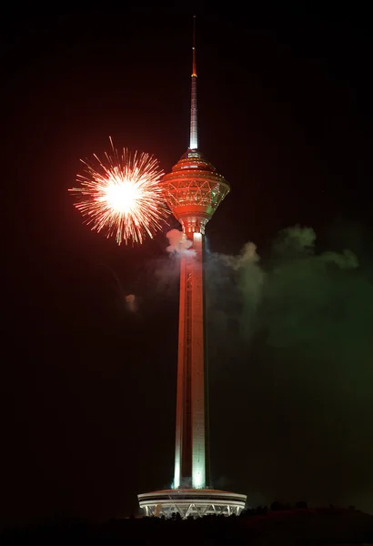 Milad Tower Illuminated with Red Firework against Black Sky