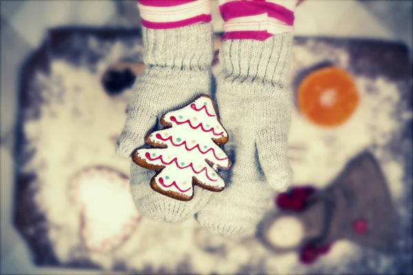 Child holding gingerbread cookies - Vintage Christmas background