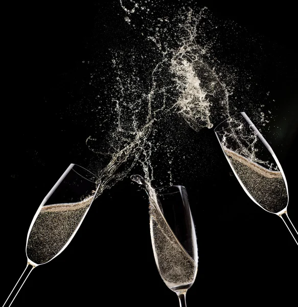 Champagne flutes on black background