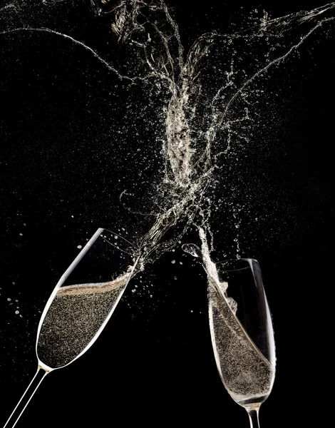 Champagne flutes on black background