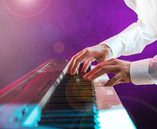 Man with piano keyboards.