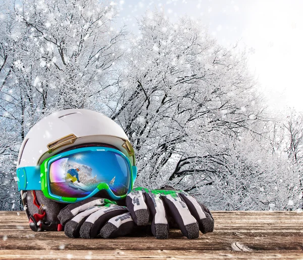Colorful ski glasses, gloves and helmet