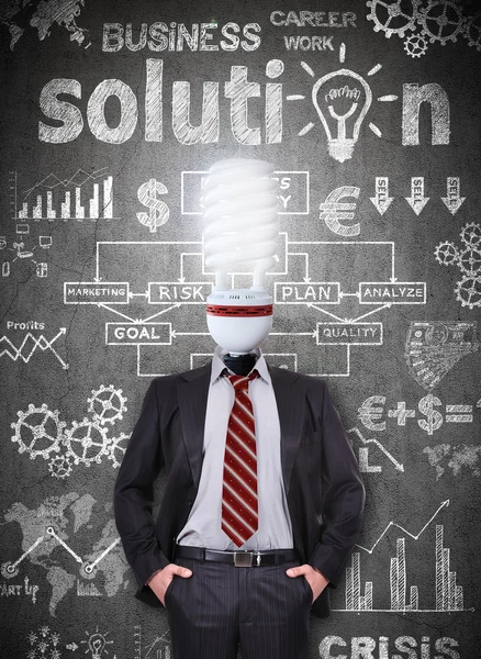 Businessman with head energy saving bulb