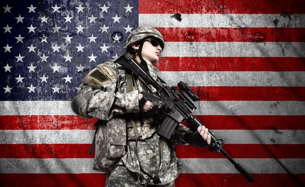 Soldier on american flag background