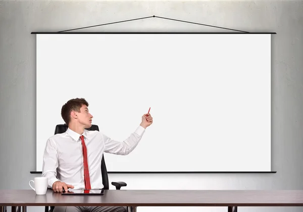 Businessman showing a blank poster