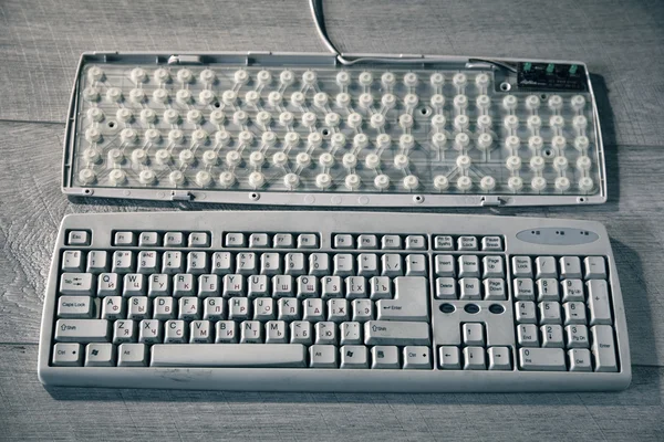 Old dirty computer keyboard. Inside view