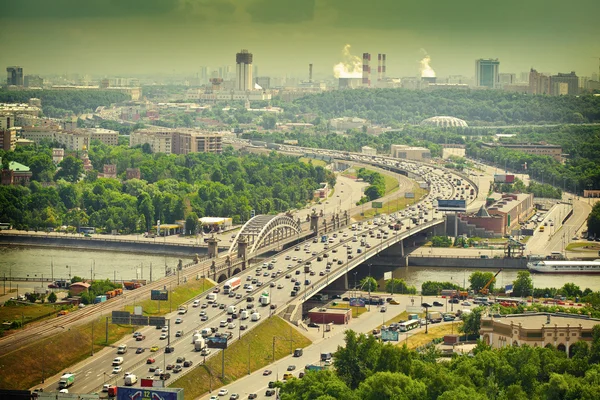 Moscow - city landscape. Road with cars at rush hour. The Third Ring Road. Life of the big city. Moscow river