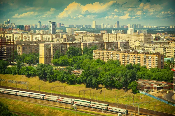 Moscow skyline. historical part of the city. Railway station in the foreground. Photo tinted in yellow