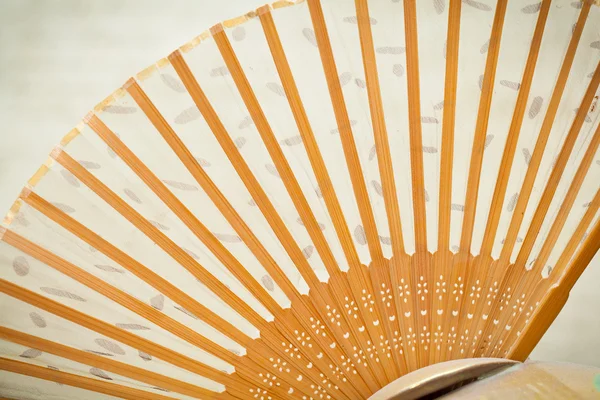 Wooden folding fan closeup