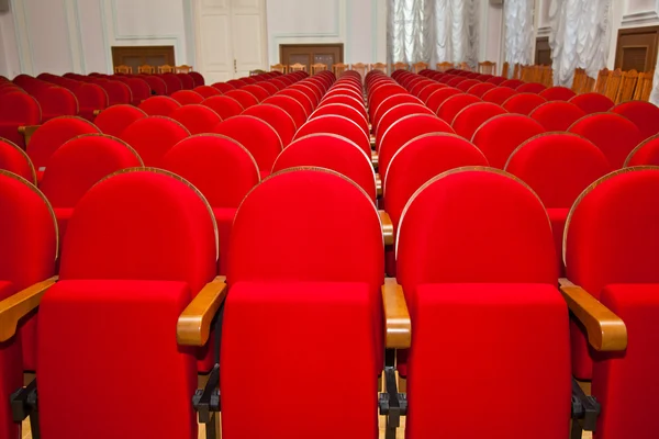 Empty hall without people. red empty chairs