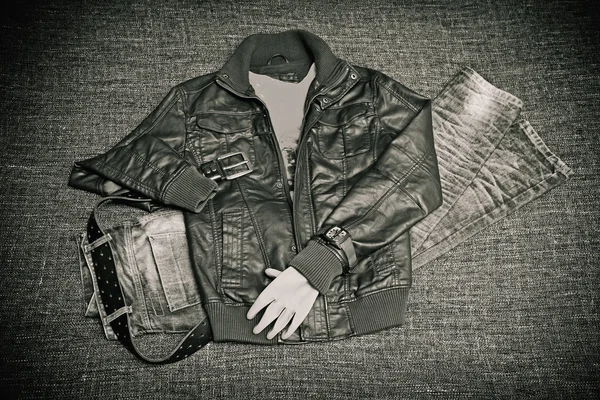Fashion concept - leather jacket, jeans, belt and watch