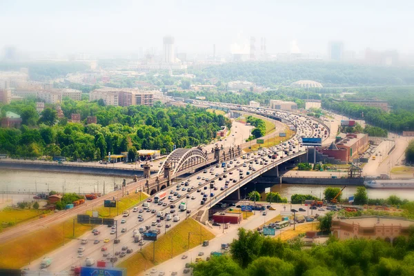 Panorama of Moscow in the haze, Russia. Third Ring Road with cars, Moscow river.