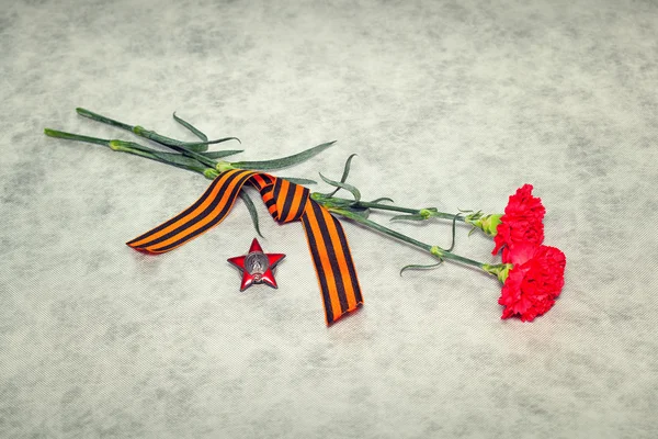 Two colors cloves, George Ribbon and the Order of the Red Star. Victory Day in the Great Patriotic War