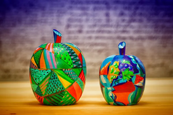Decorative fruit apples, made of wood and painted by hand paints. Modern art.