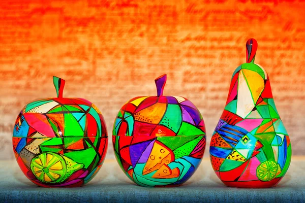 Decorative apple and pear, made of wood and painted by hand paints