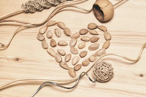 Decorative background of natural art objects made of bamboo, wood, cane. Heart - symbol of love