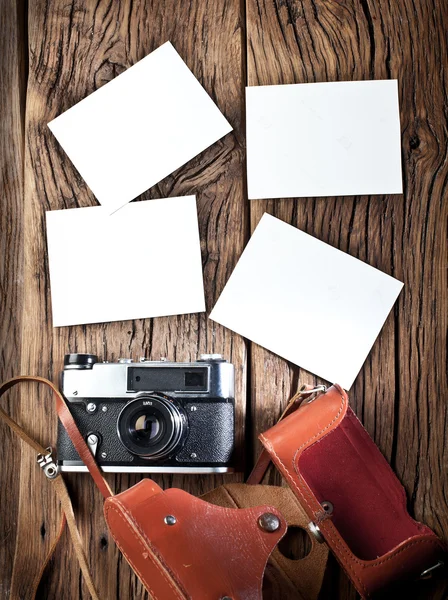 Old rangefinder camera and black-and-white photos.